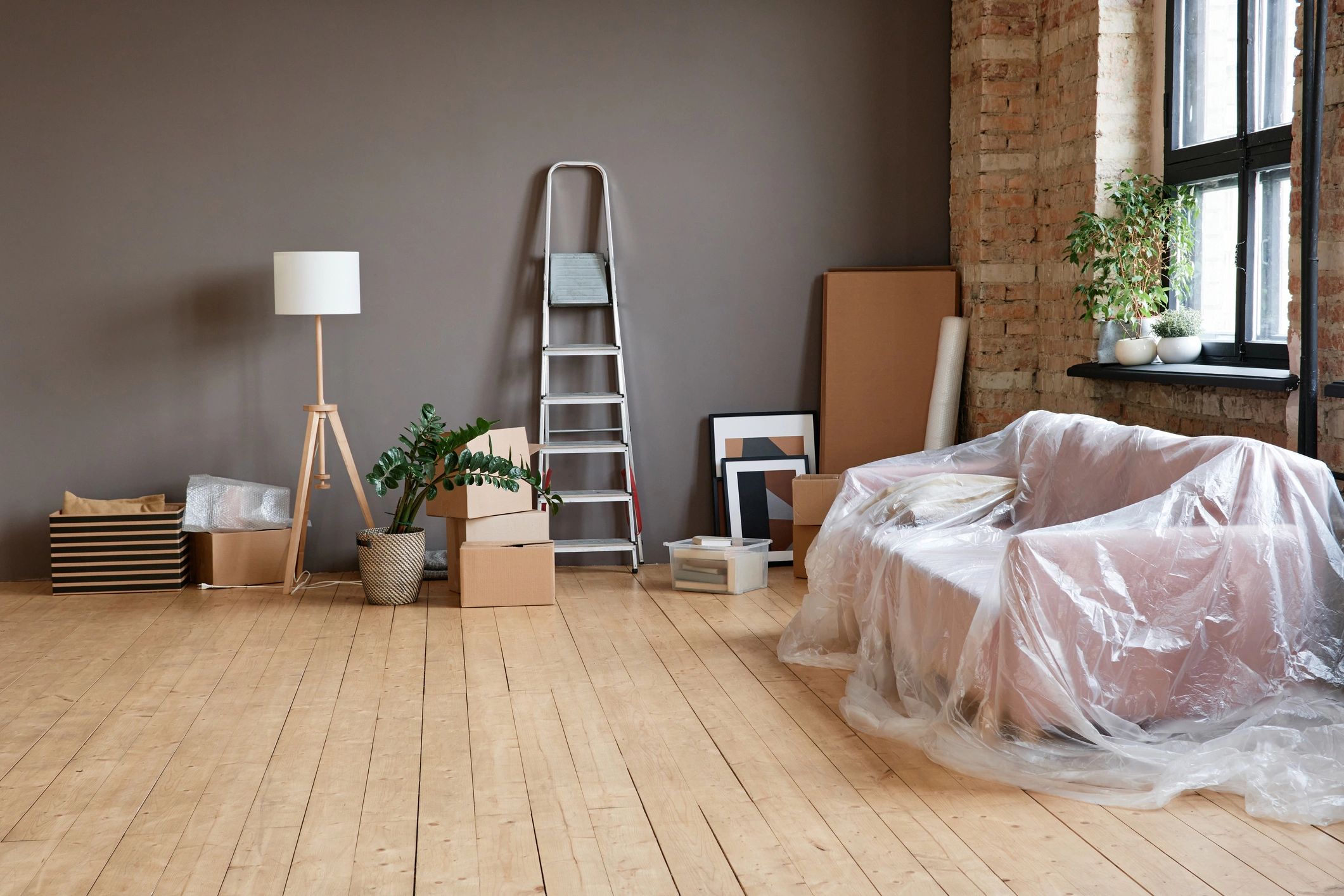 Property turnover space with boxes and cleanup needs